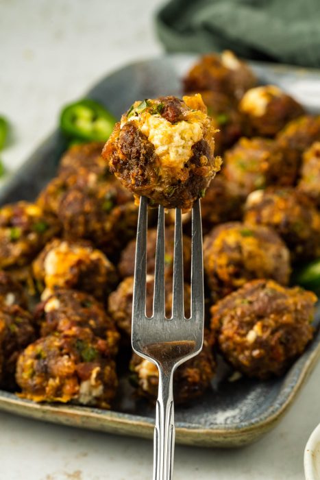 Jalapeno Popper Meatballs on a fork.