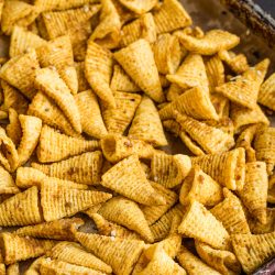 A baking sheet with Bugles on it.