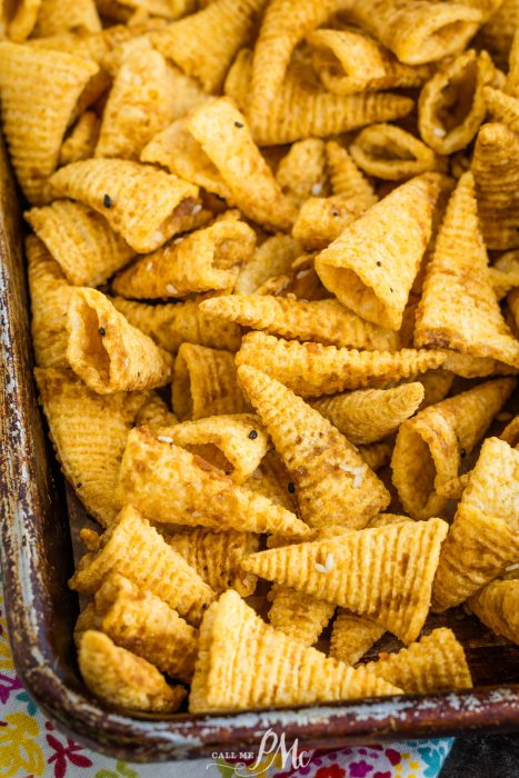 Snack mix in a baking dish.