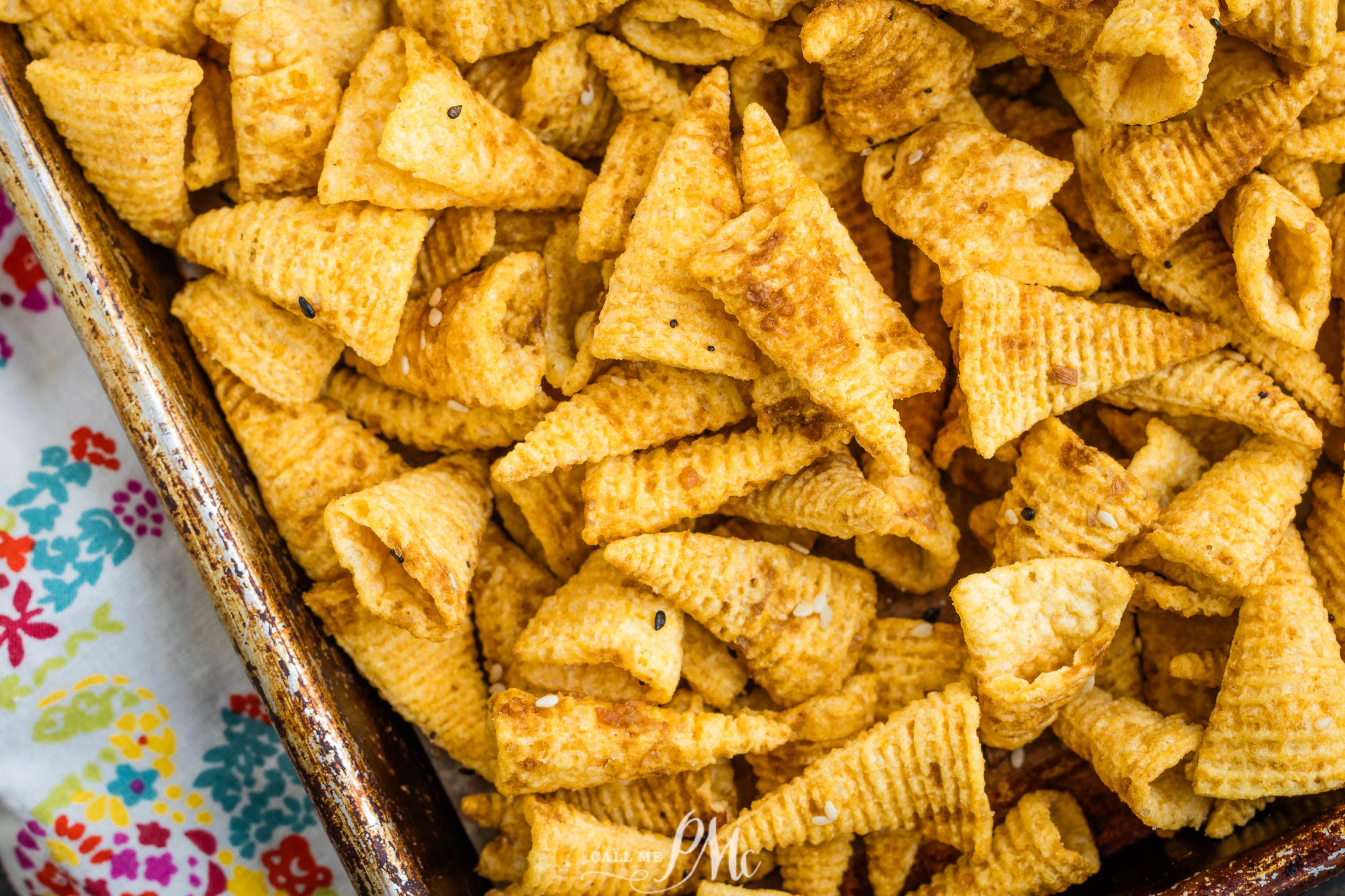 Bugles Chex Mix in a baking dish.