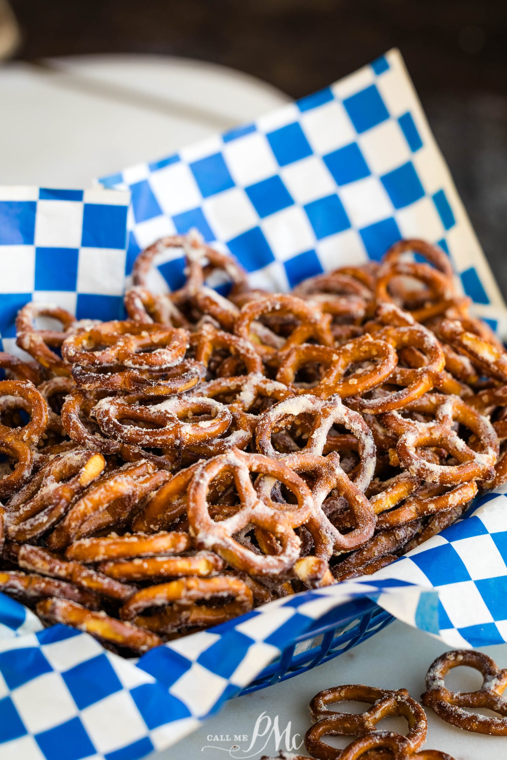 Pretzels in a blue and white checkered basket.