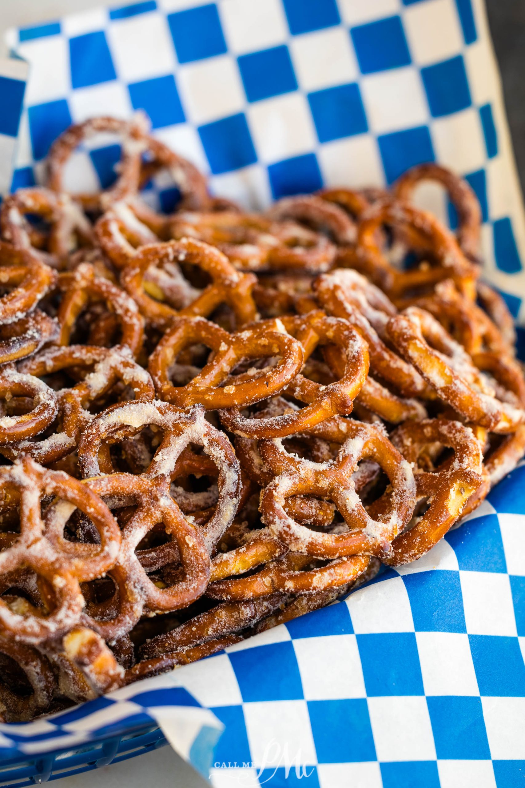 A basket of Cheddar Pretzels Recipe on a blue and white checkered tablecloth.