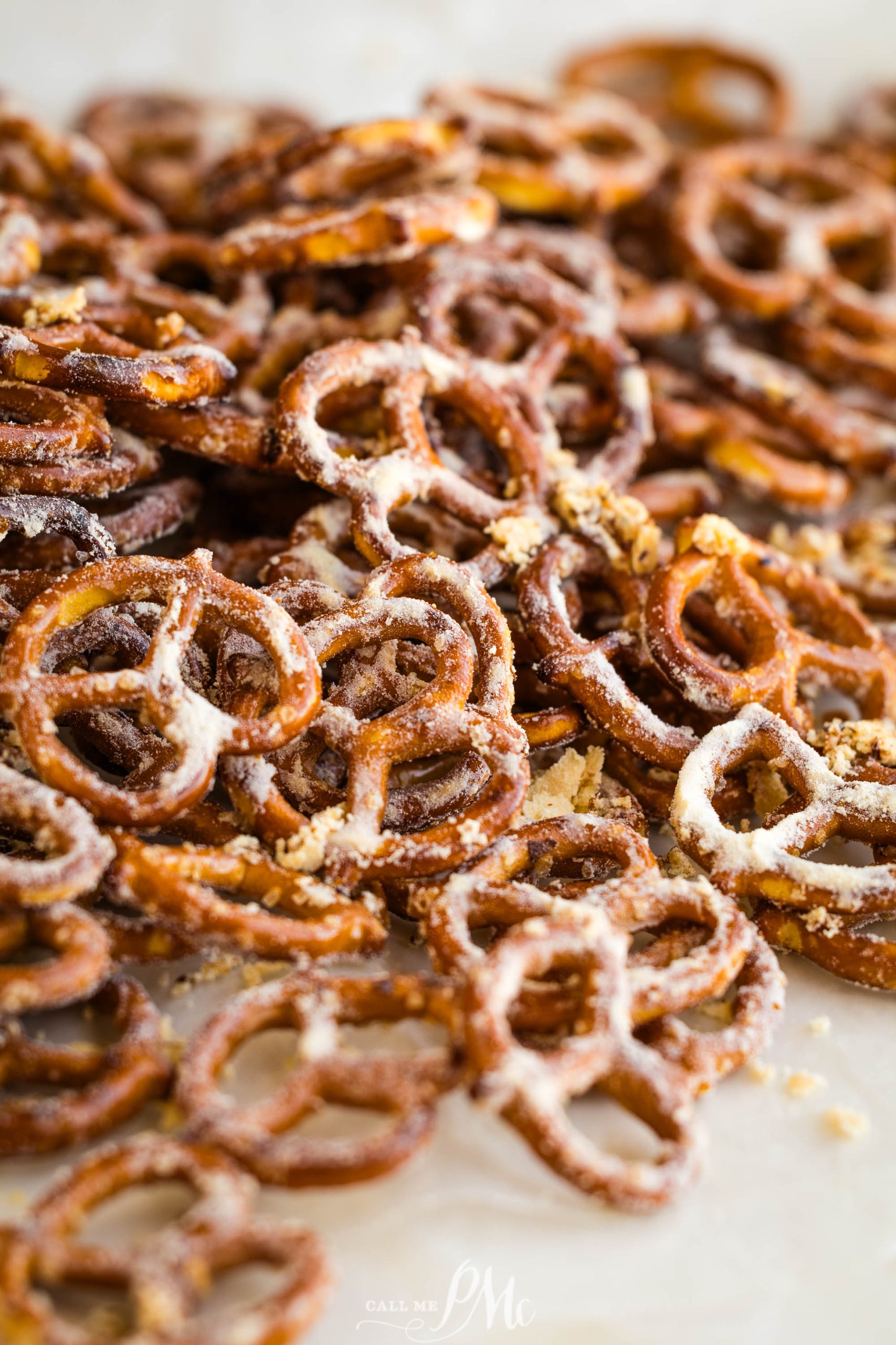 A pile of pretzels on a baking sheet.