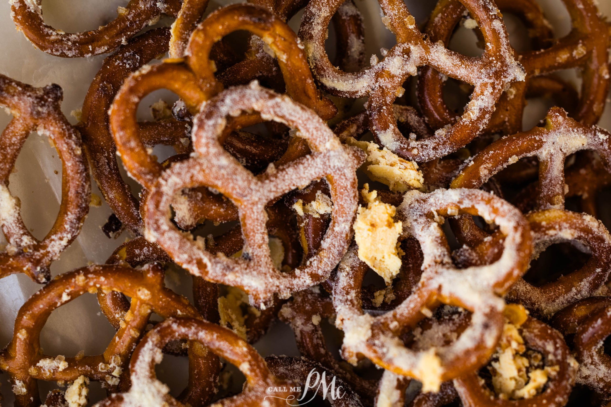 A pile of pretzels on a white plate.