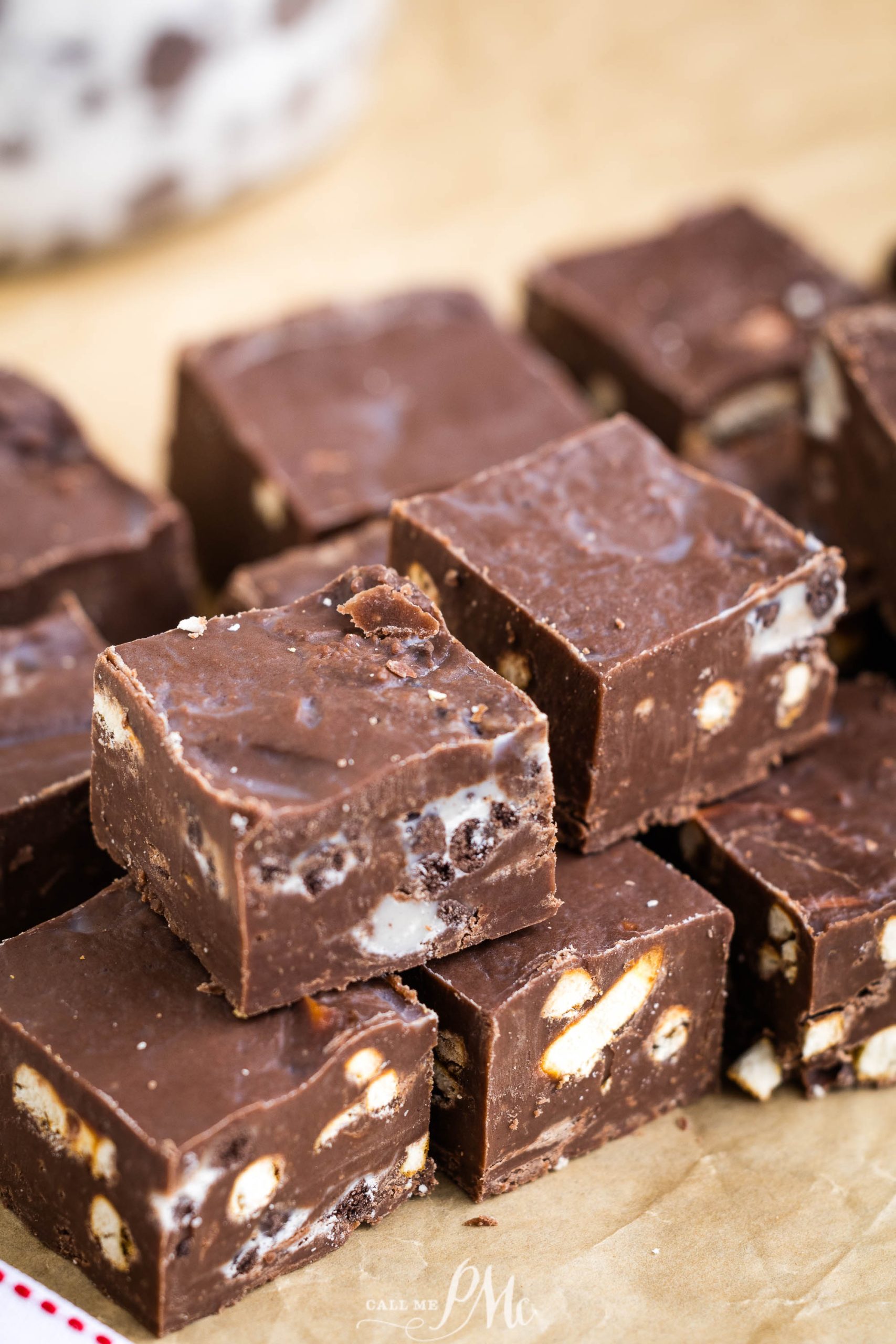 A pile of chocolate fudge on top of a piece of paper.