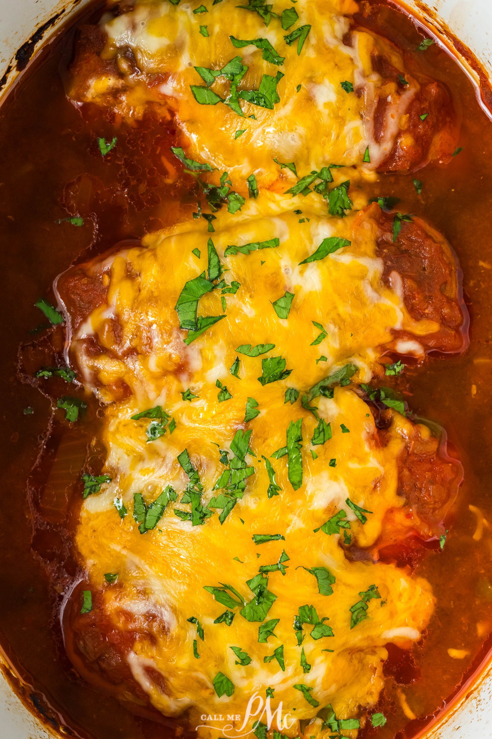 Crockpot Cheesy Salsa Chicken in a white pot.