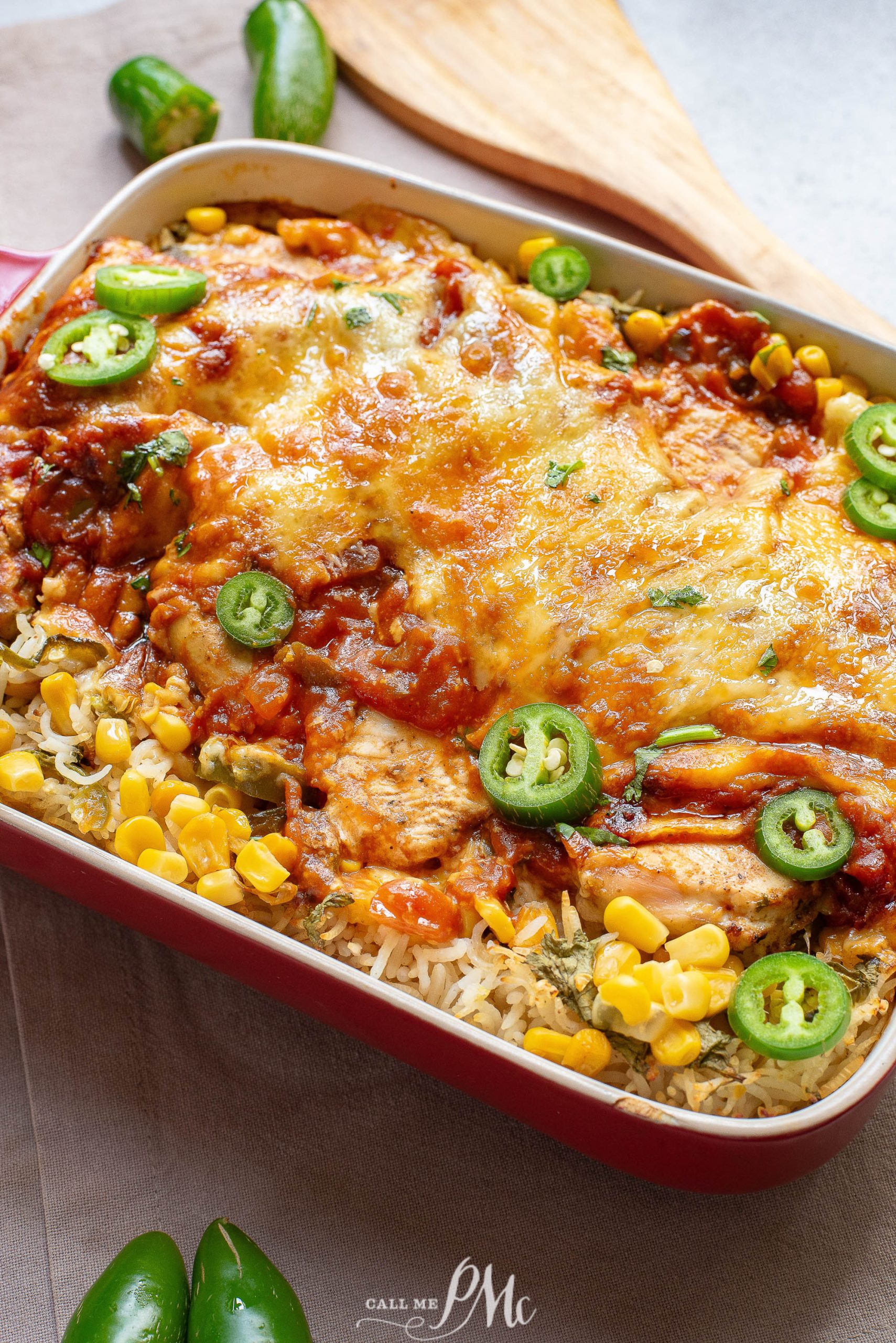 Chicken enchilada casserole with corn and jalapenos.