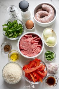 Ingredients for meatballs with rice and peppers.