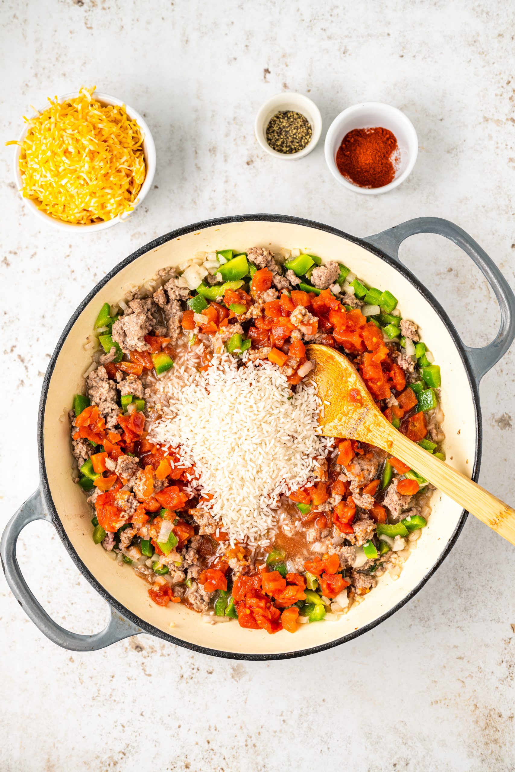 A skillet filled with Cheddar Beef and Texas Hash.