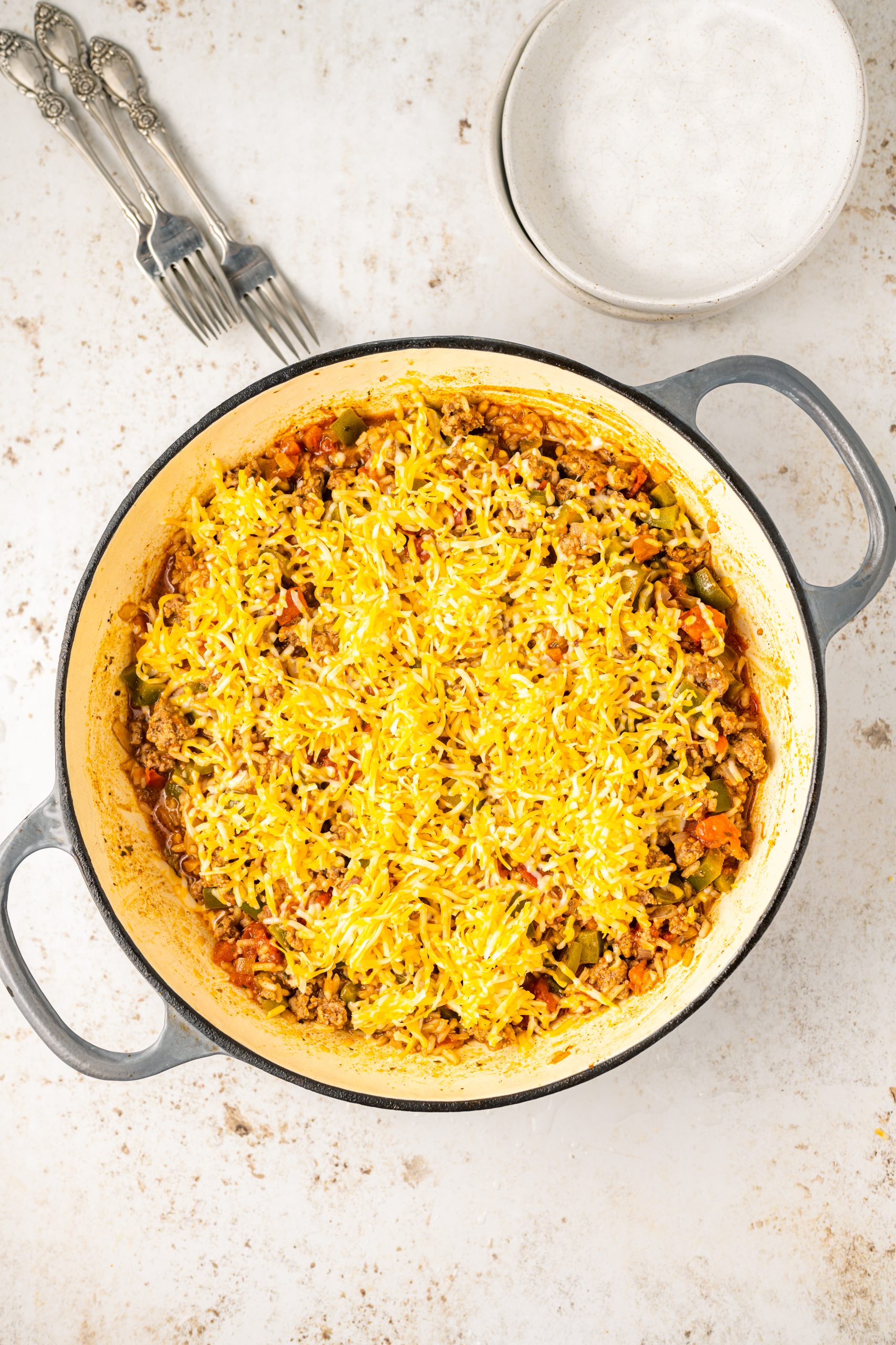 A pan with a dish of Cheddar Beef Texas Hash in it.