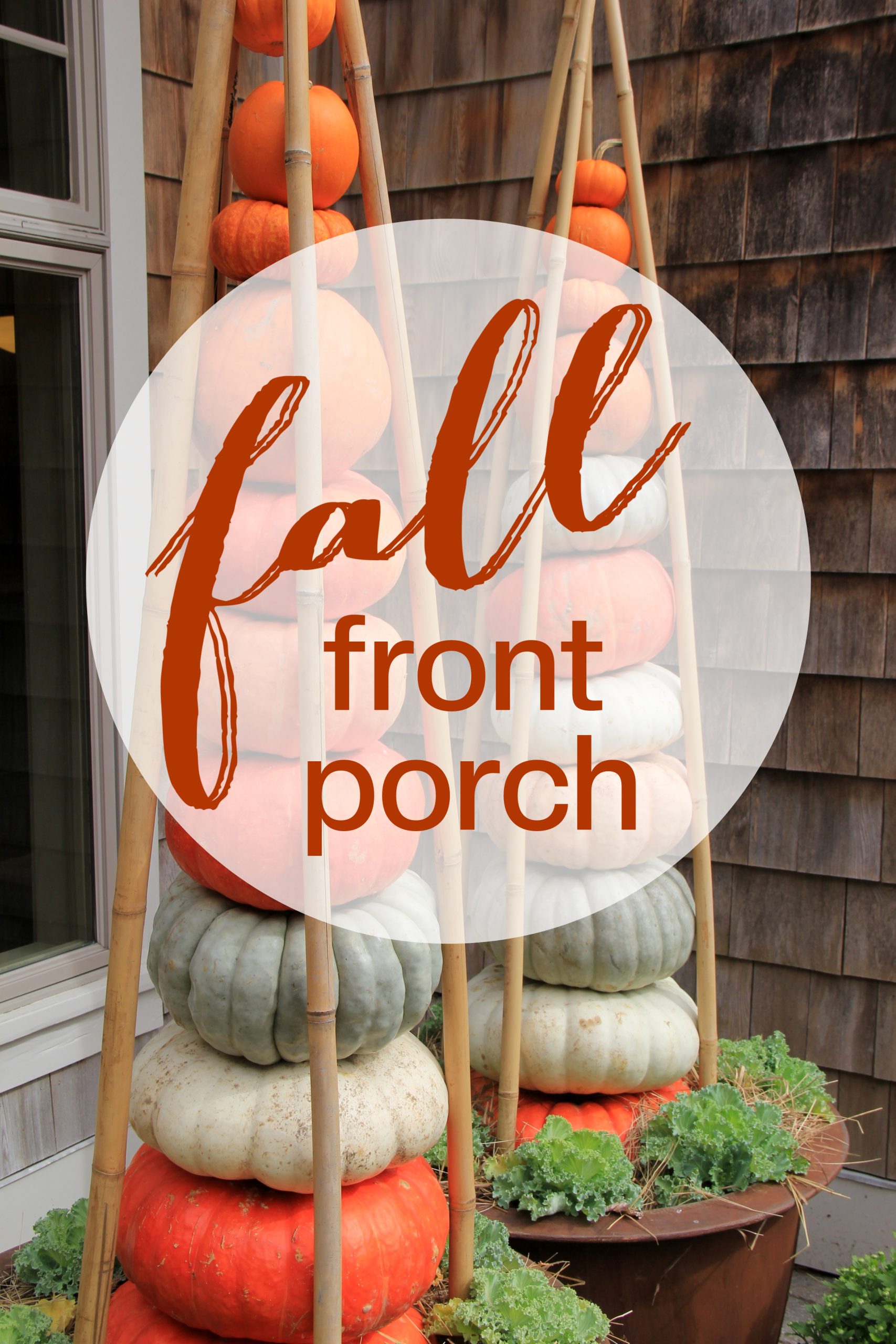 A fall front porch with pumpkins and twigs.