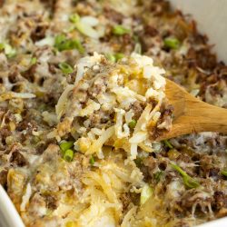 A casserole dish with a wooden spoon.