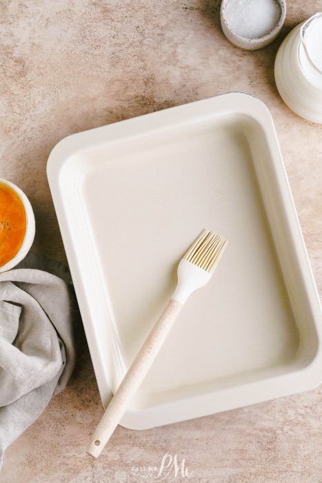 A baking dish with a fork next to it.