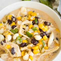 Mexican chicken chowder in a bowl with corn and black beans.