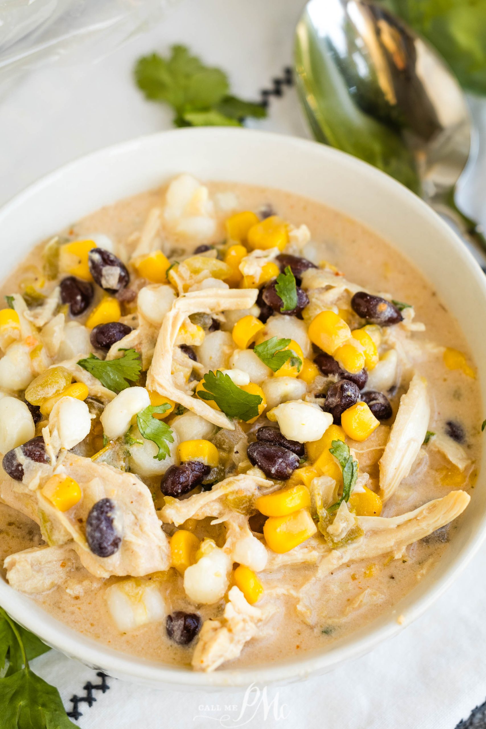Mexican chicken chowder in a bowl with corn and black beans.