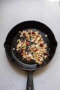 A frying pan with food in it.