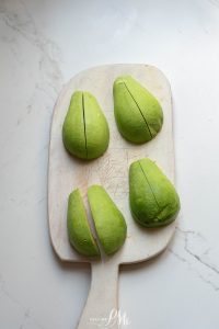 Pear slices on a wooden cutting board.