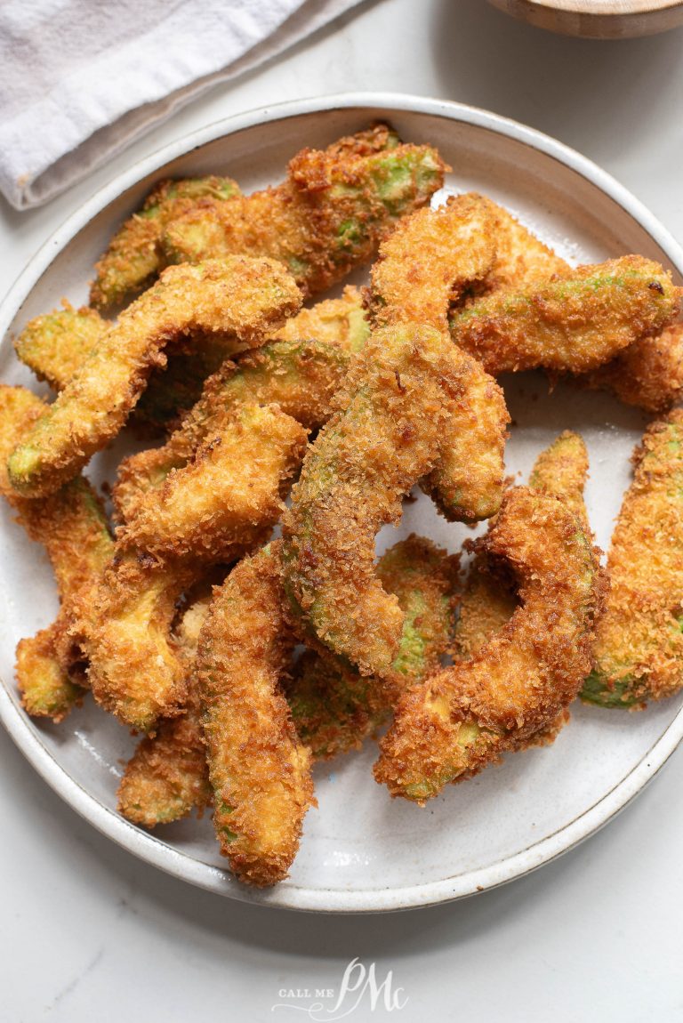 Fried avocado sticks on a plate.