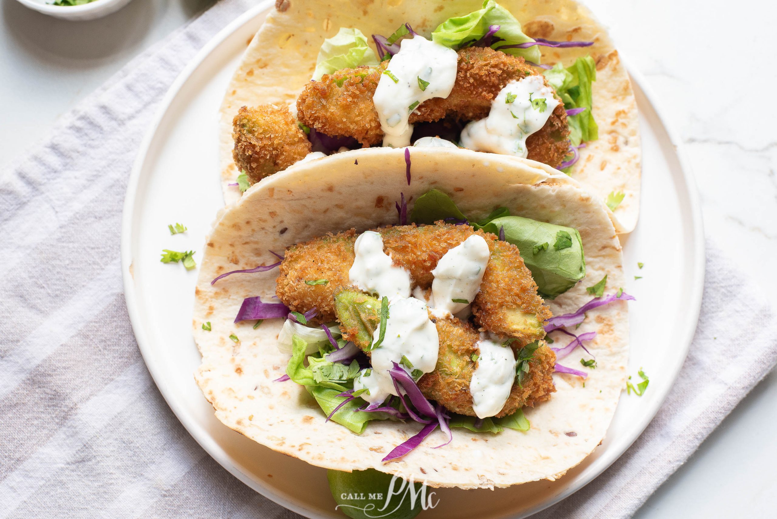 Meatless tacos on a white plate.