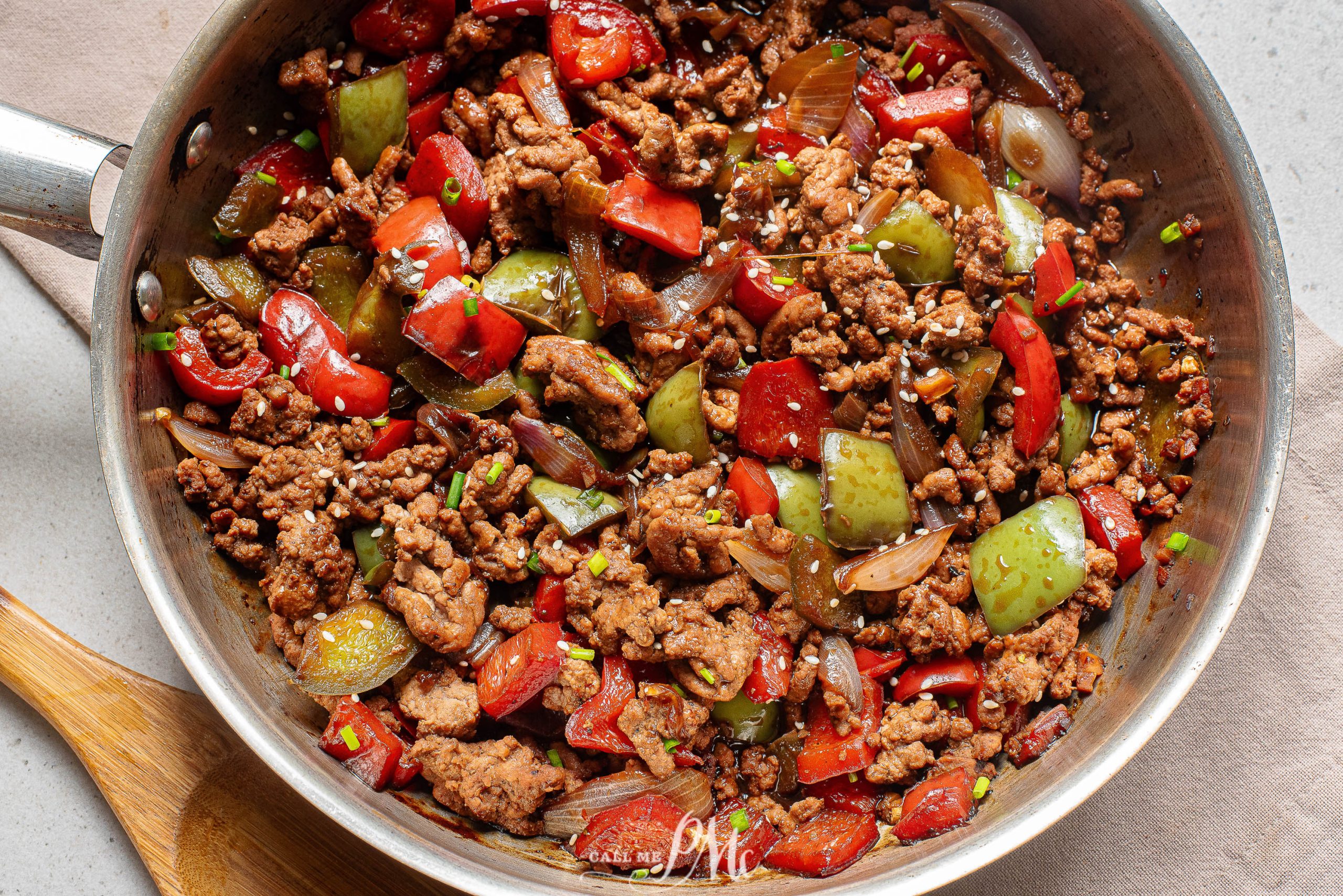 A pan with meat and vegetables in it.