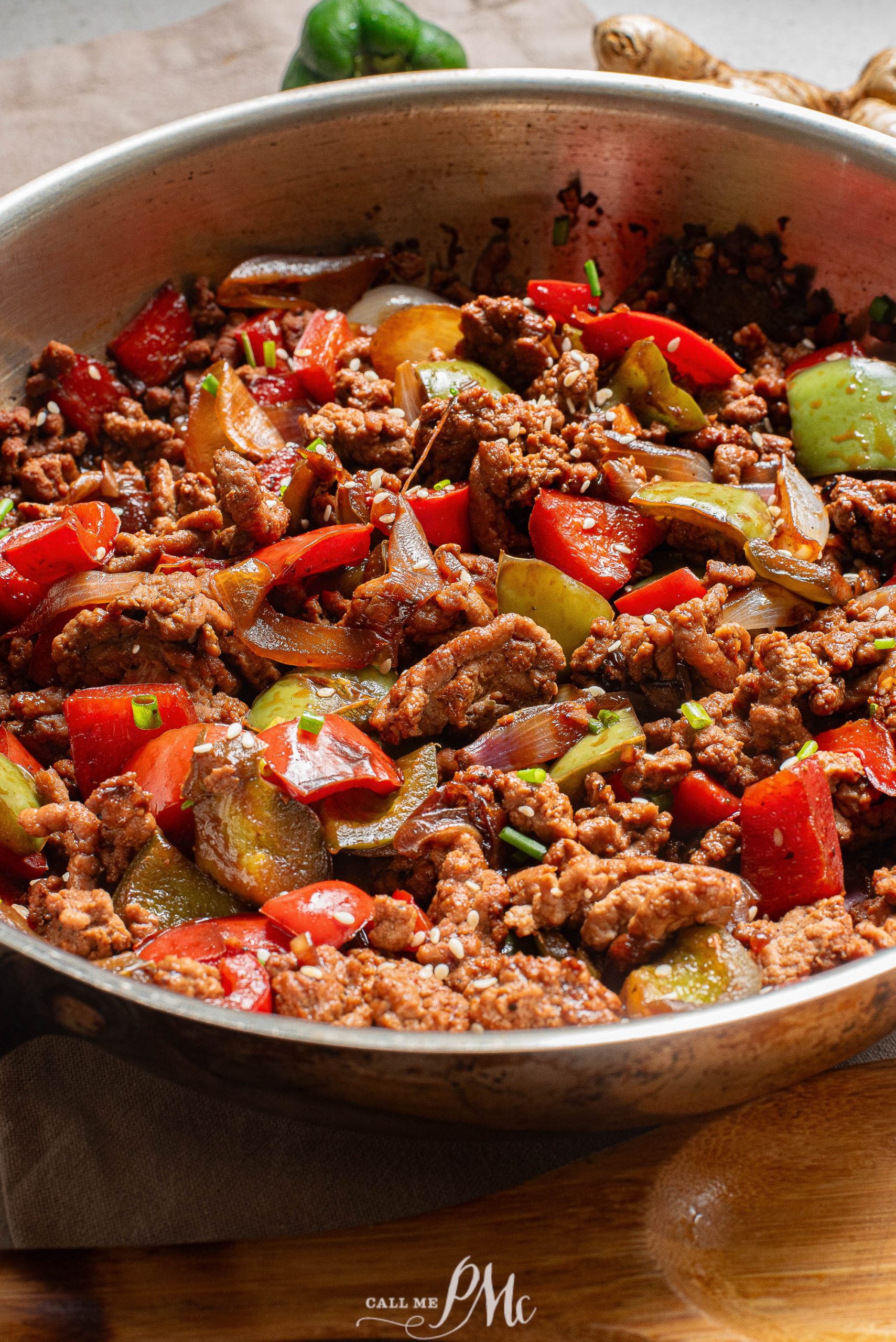 A pan with meat and vegetables in it.