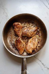 Fried chicken in a frying pan.