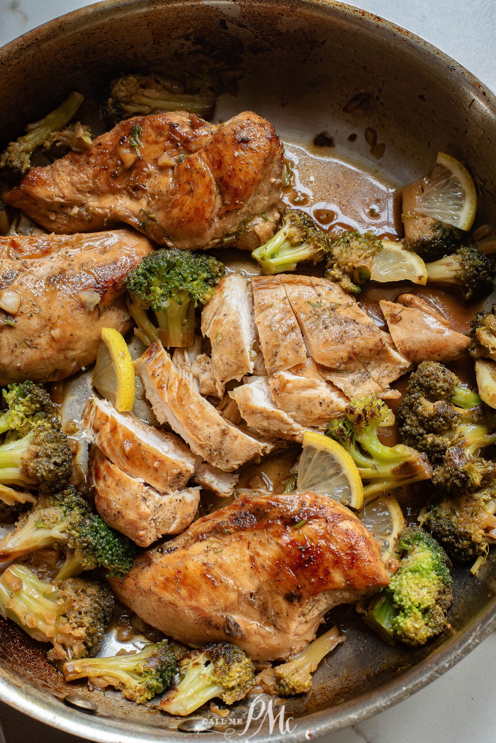 Chicken and broccoli in a skillet.