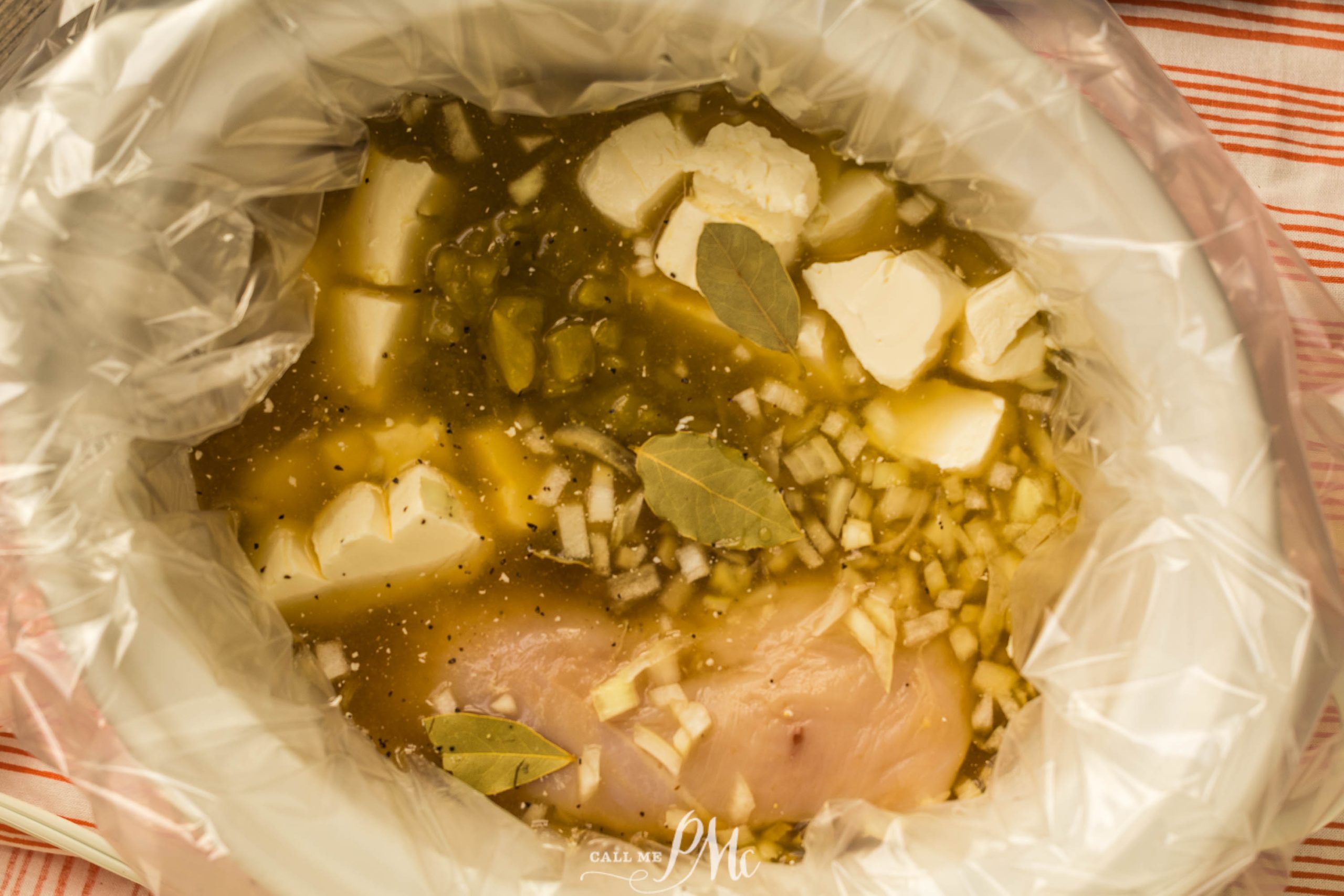 A bag of chicken and vegetables in a plastic bag.