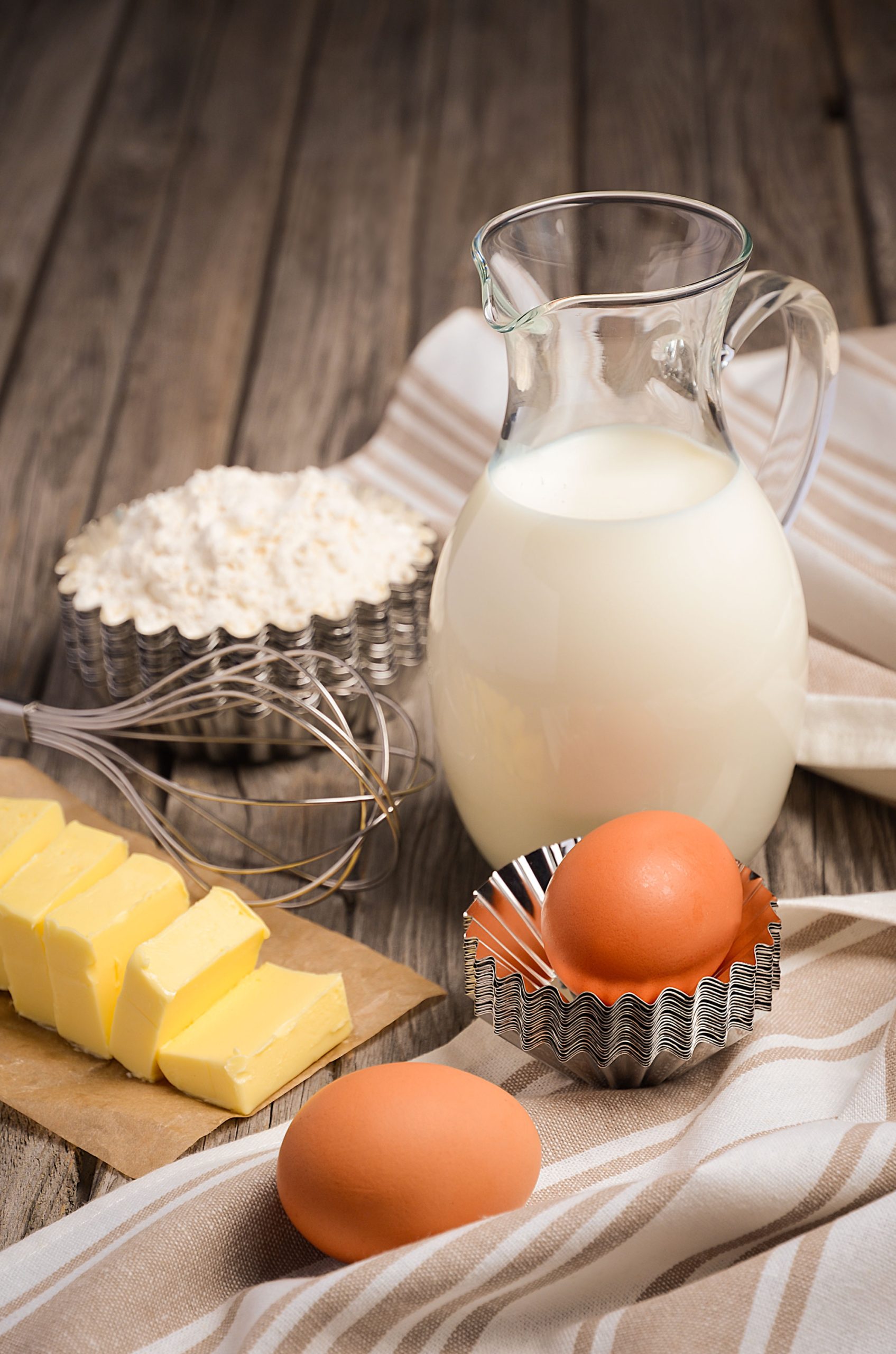 A jug of milk and eggs on a table are easy baking hacks.