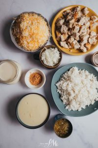 Chicken fried rice ingredients on a marble table.