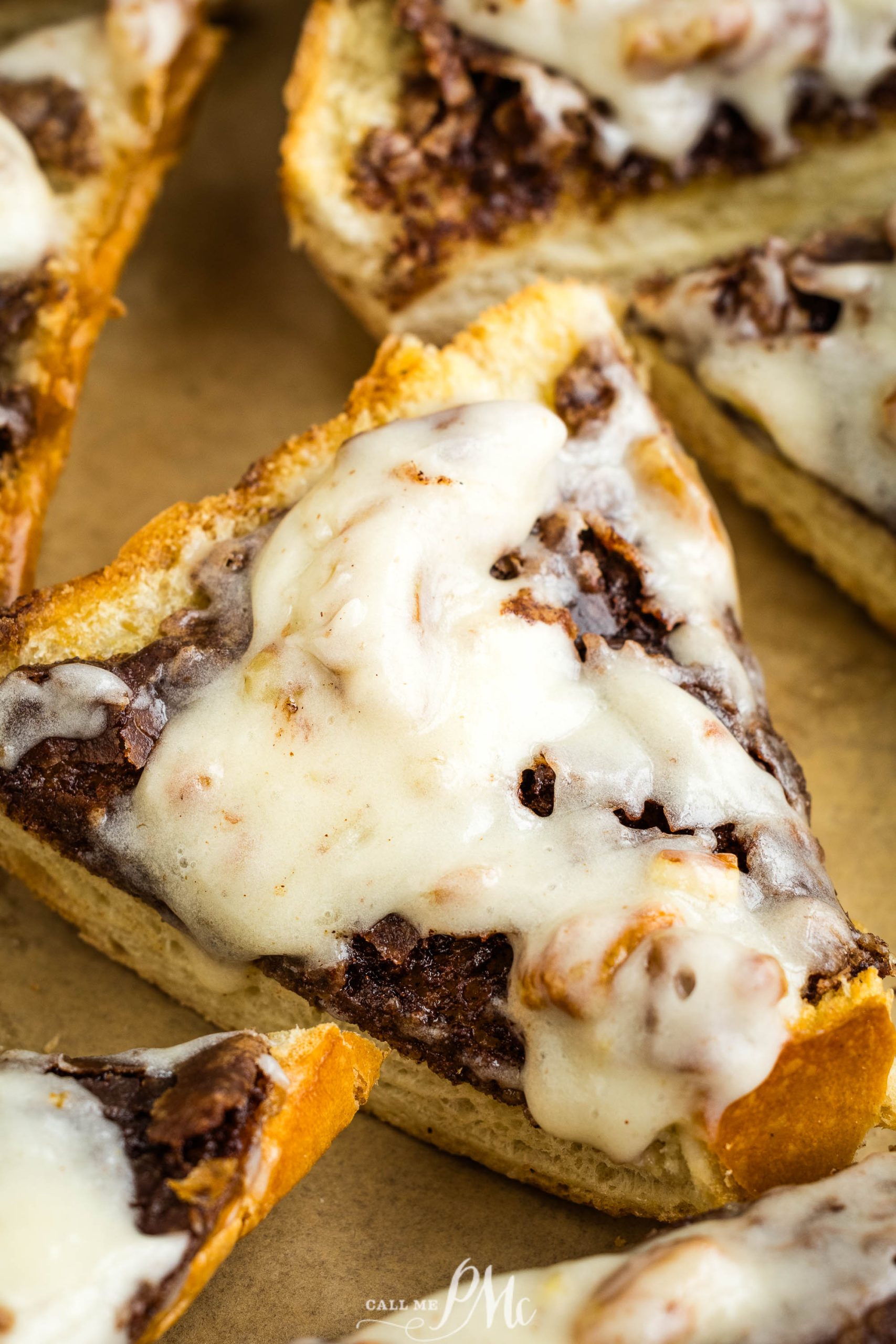 A slice of bread with chocolate icing on it.