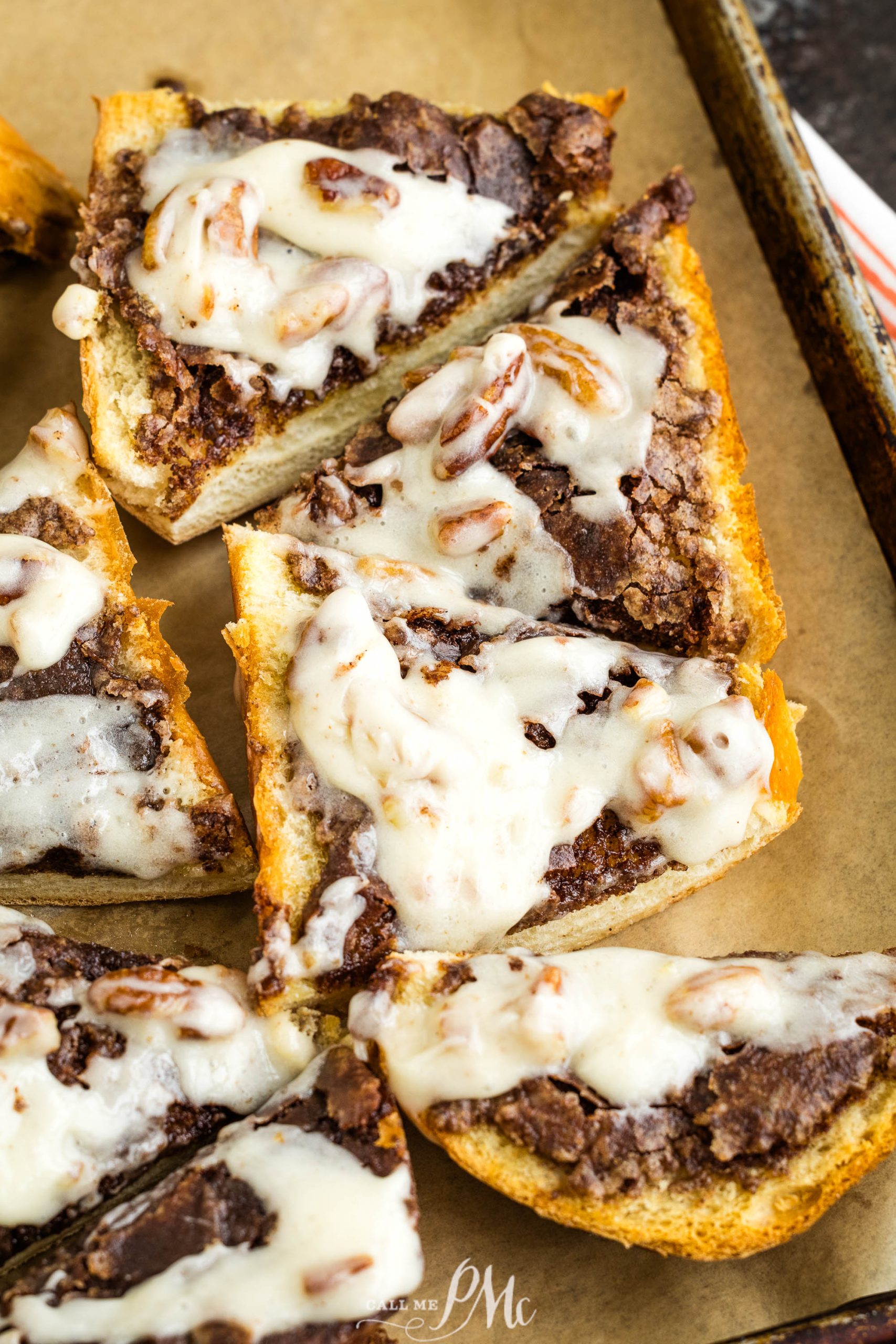 Chocolate pecan pizza on a baking sheet.