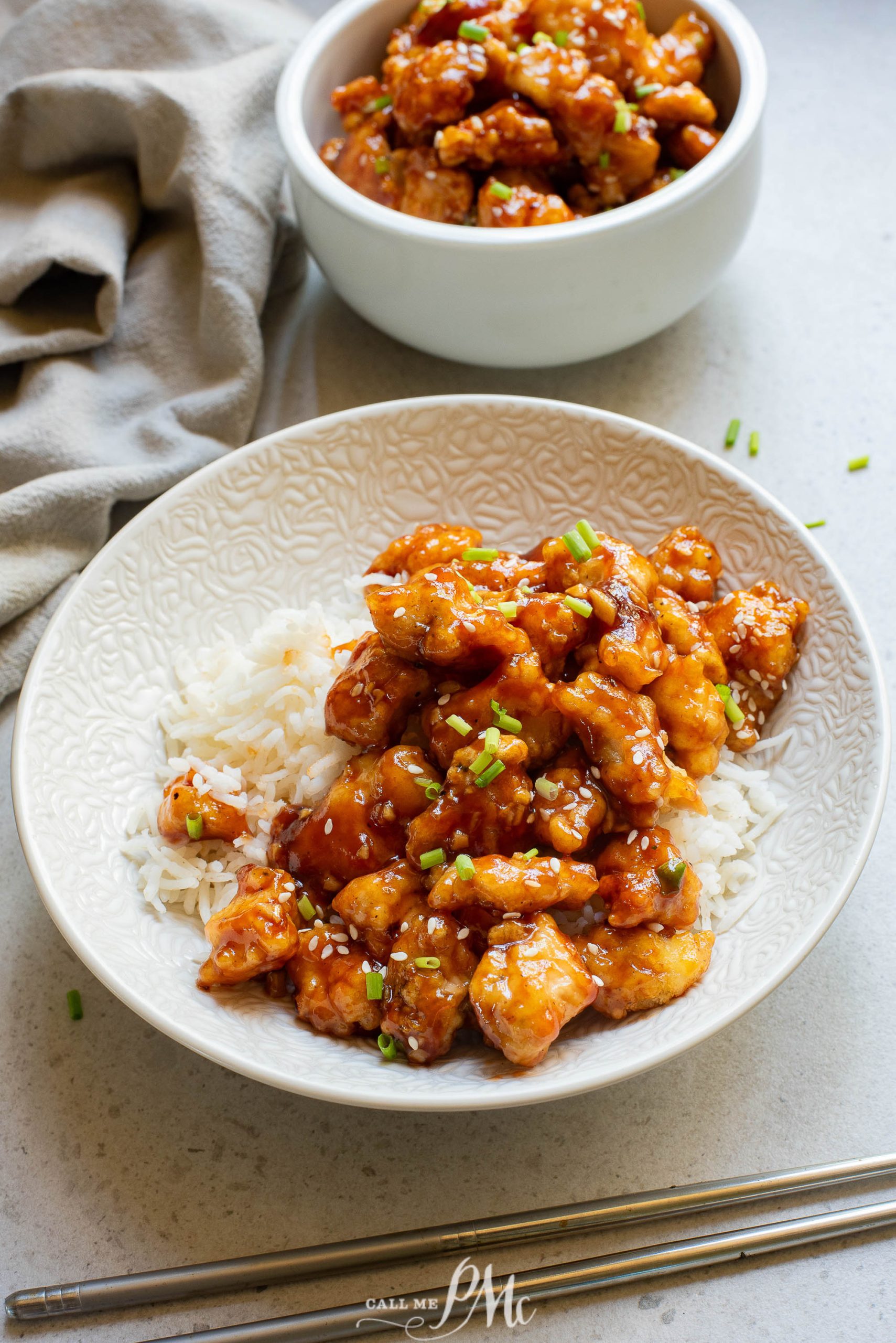 A bowl of food with Sticky Garlic Chicken Nuggets.