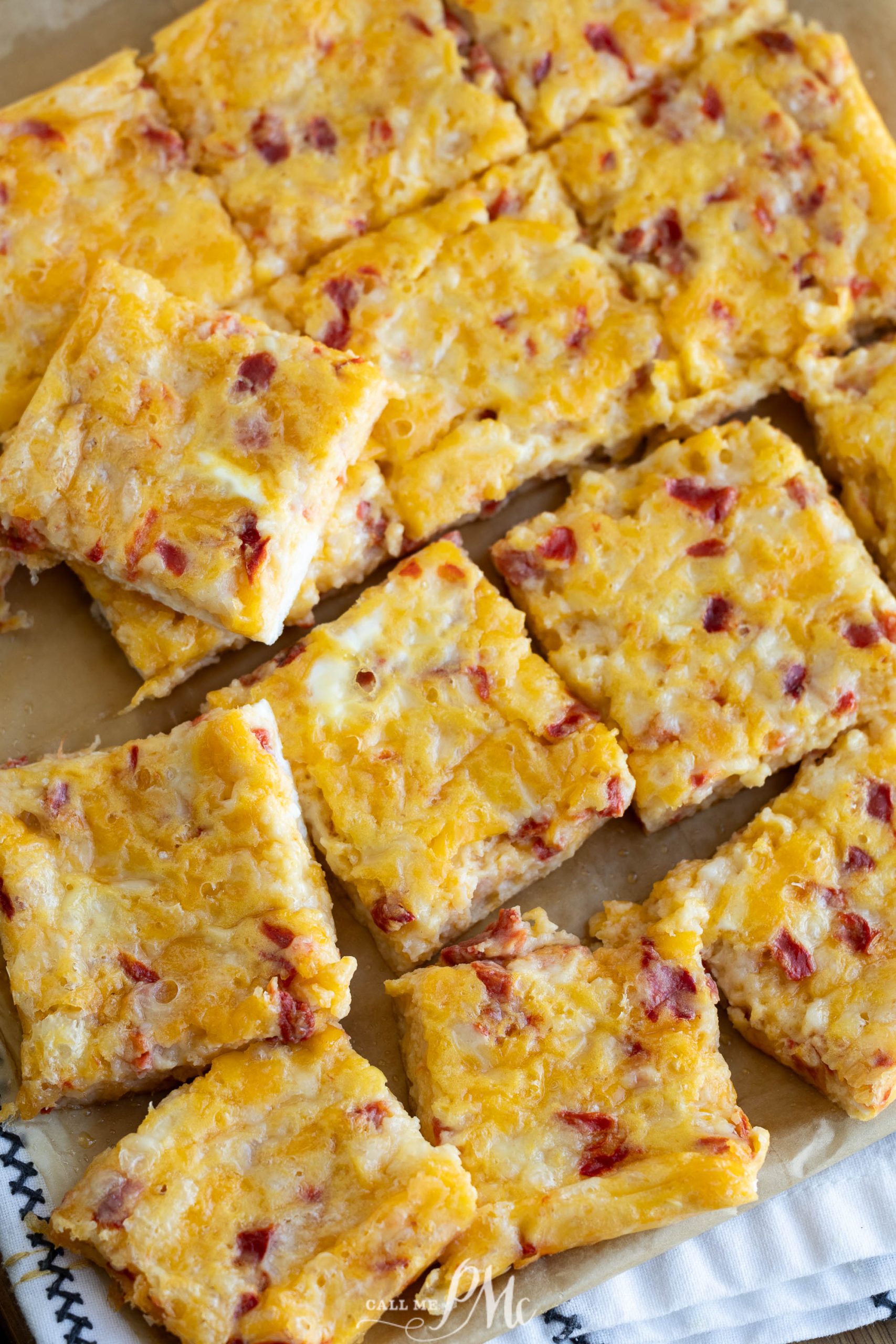 Cheese Squares with pimento on a tray.