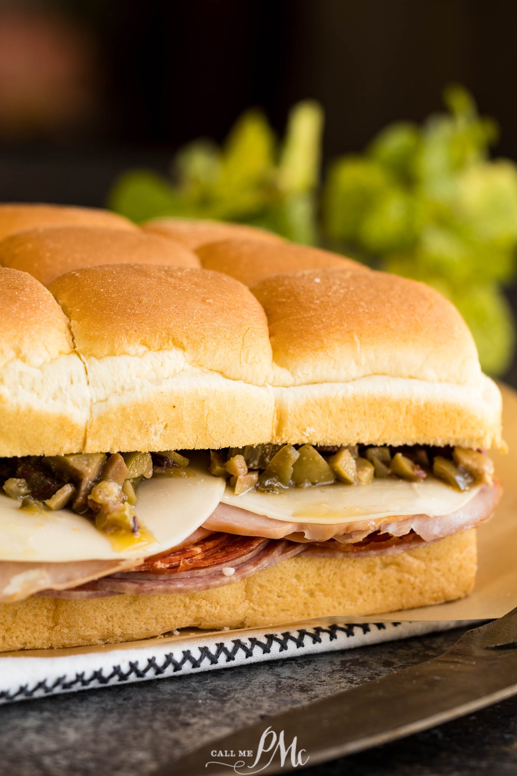 Baked Muffuletta Sliders on a plate.