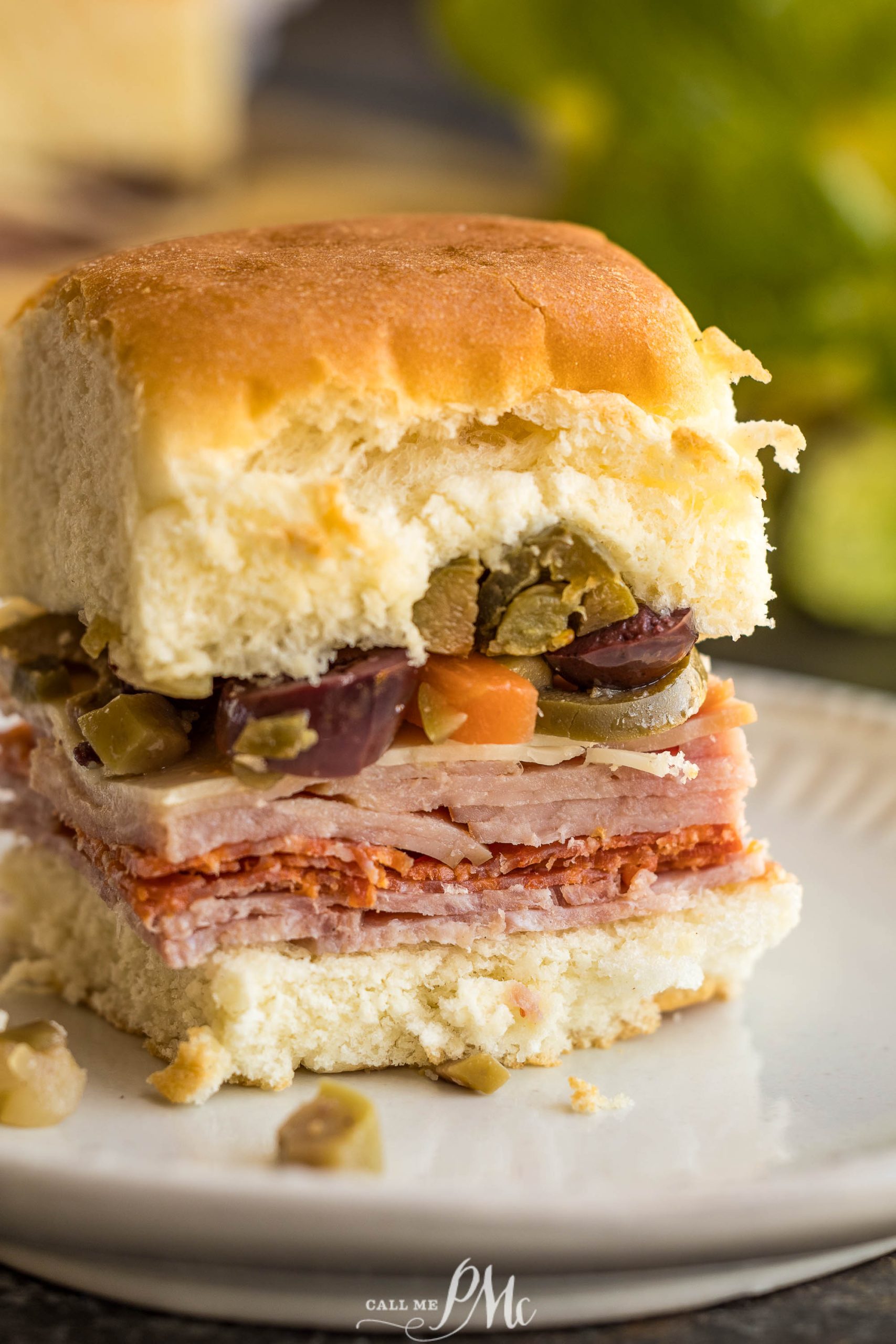 Baked Muffuletta Sliders on a plate.