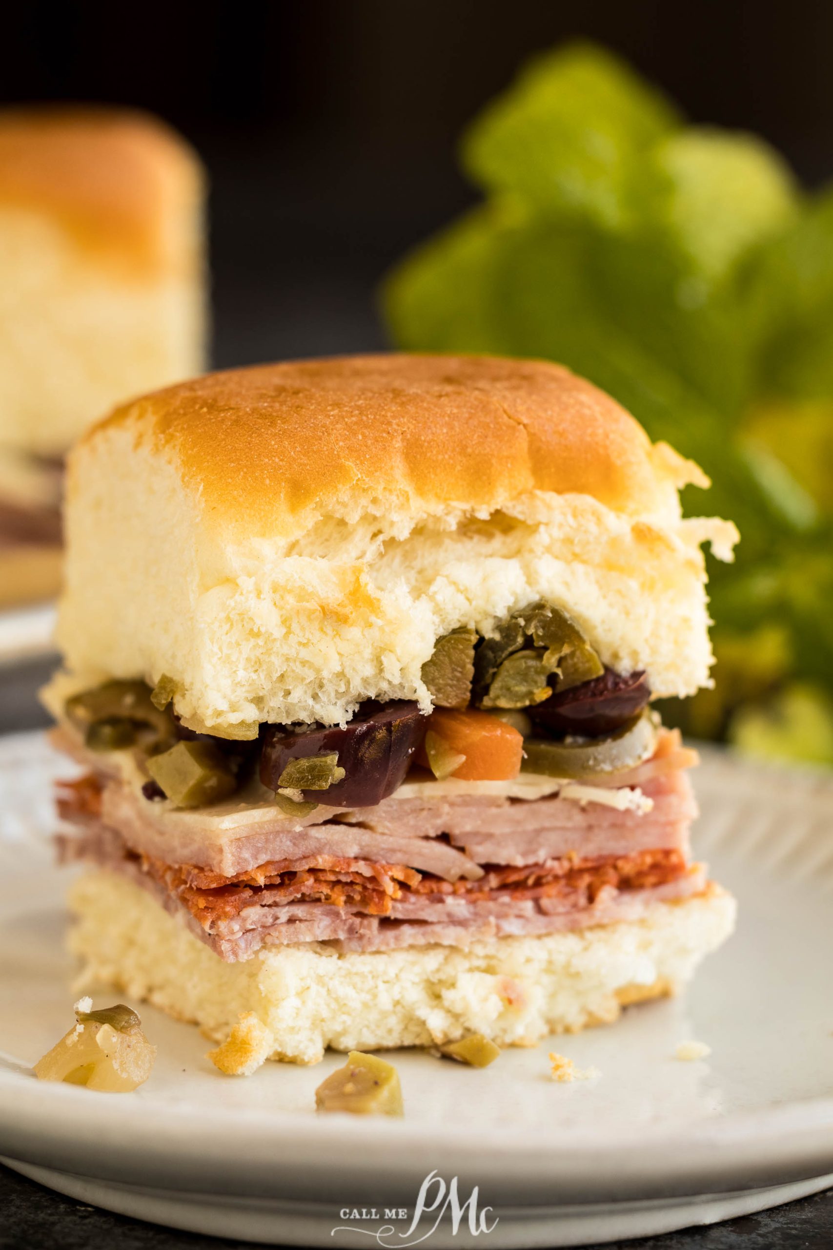 Baked Muffuletta Sliders on a plate.