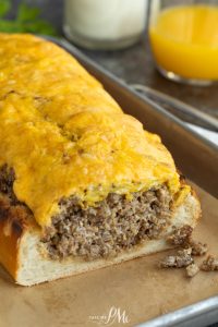 A slice of bread with cheese and meat on it.