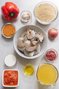 A bowl of shrimp and various bowls of food.