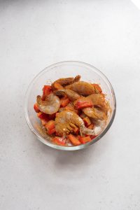 A bowl of food on a table.