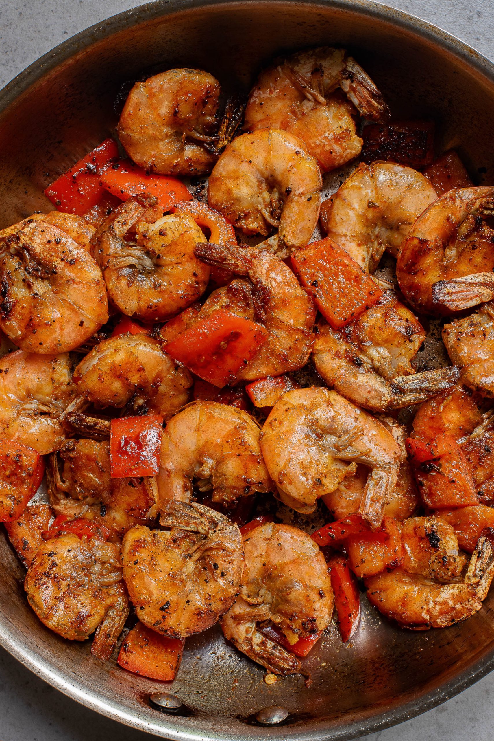 A bowl of shrimp and vegetables.