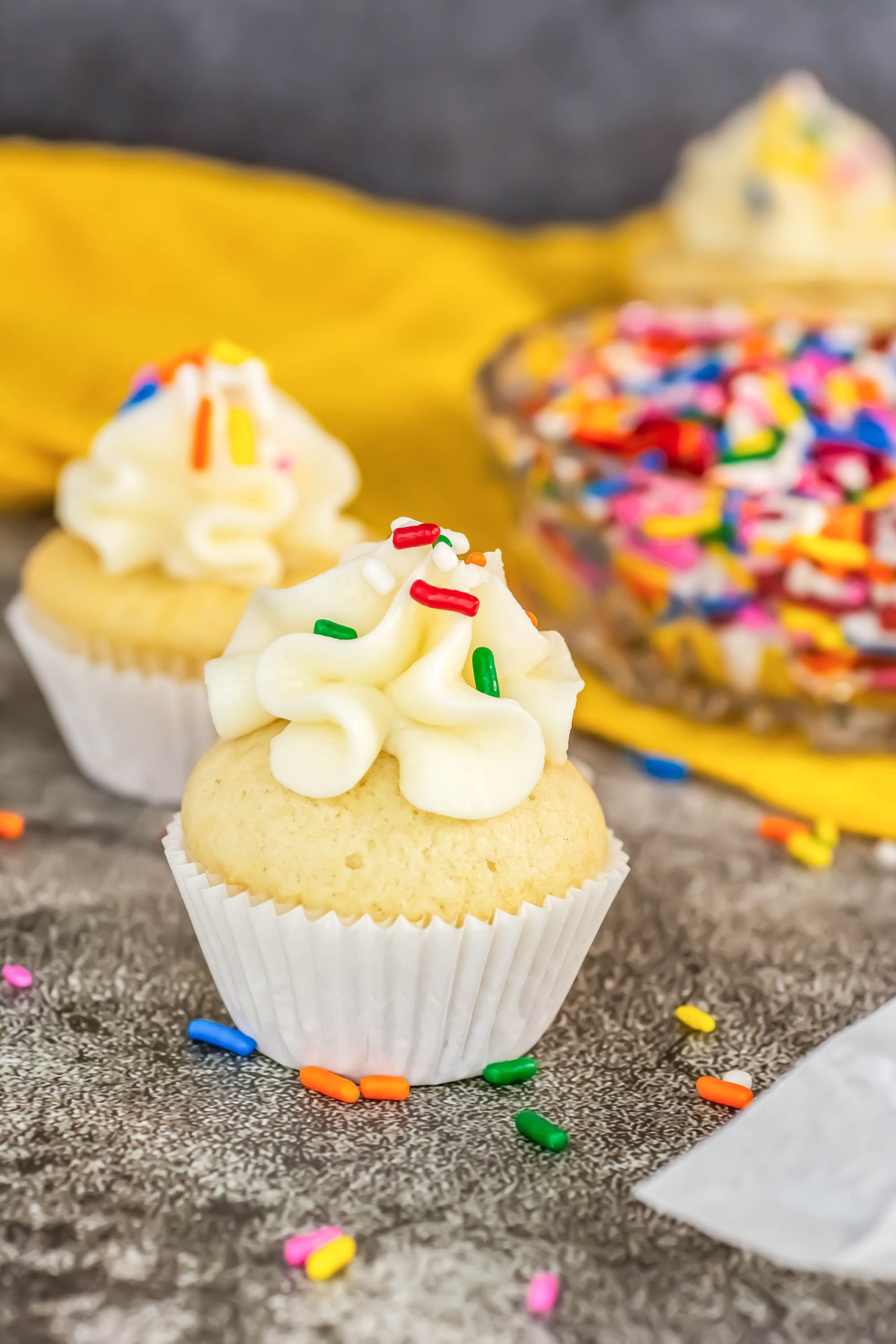 Classic Vanilla Cupcake with frosting and sprinkles.