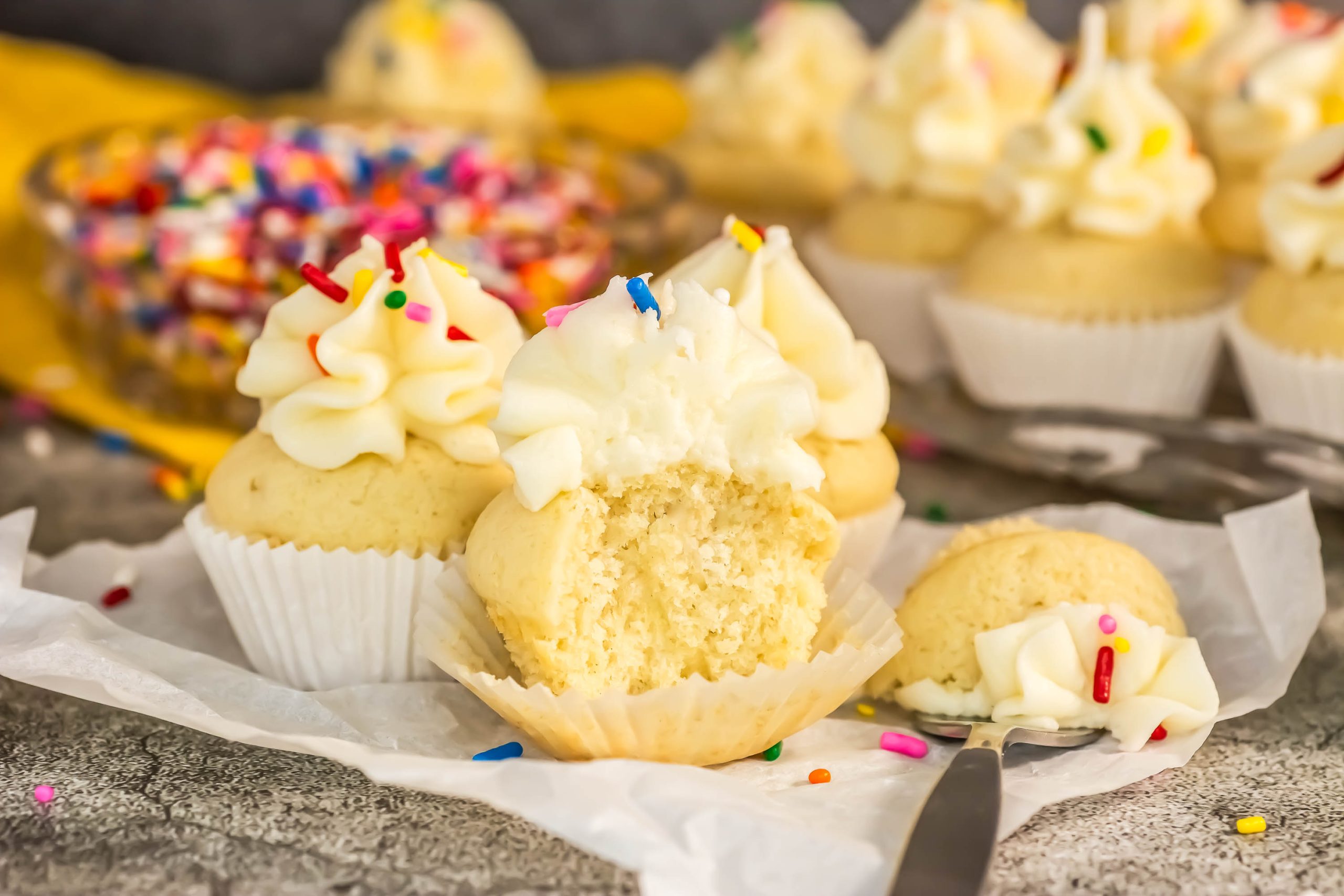 A group of cupcakes with frosting.