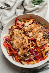 A bowl of food on a table.