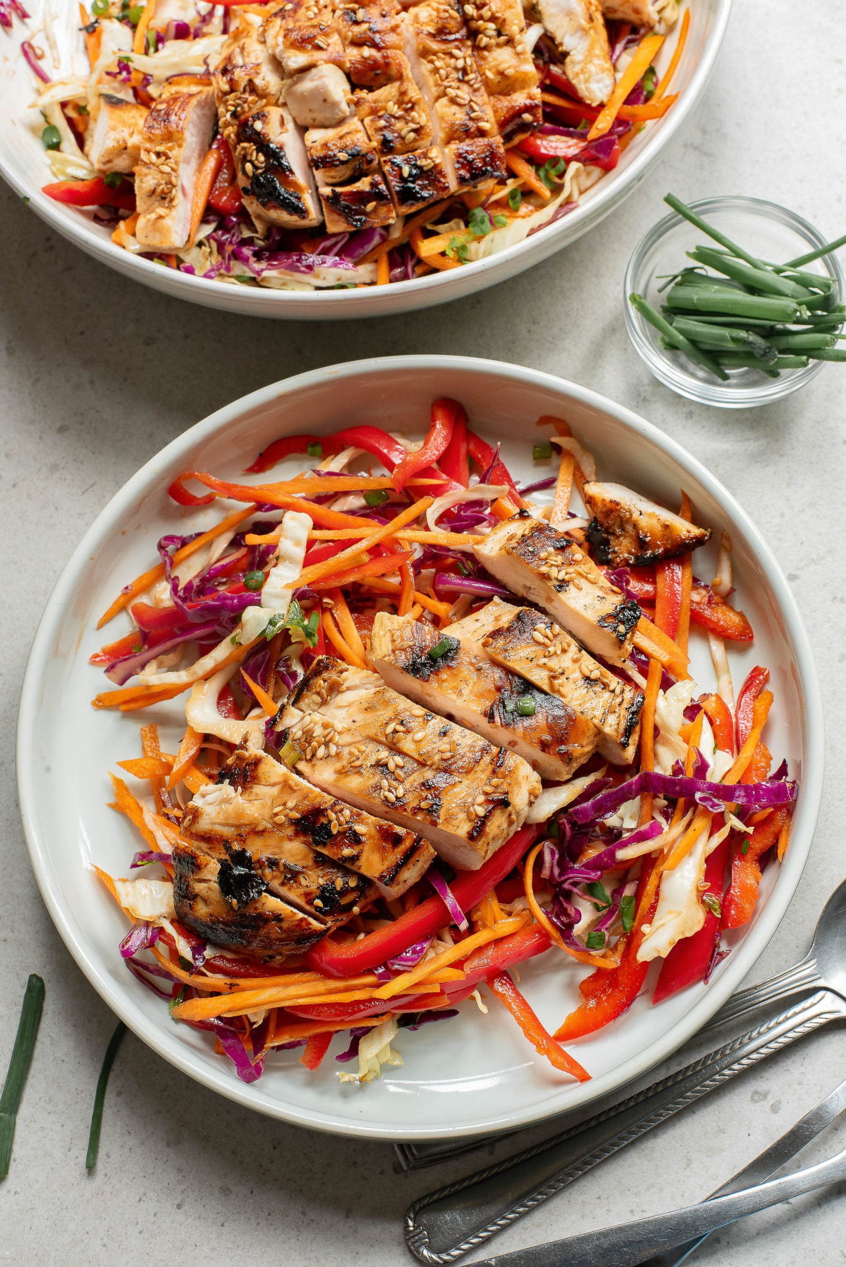 A plate of Crunchy Sesame Chicken Salad on a table.