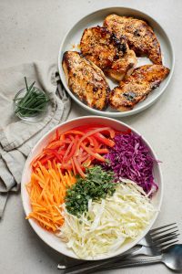 A bowl of food on a table.