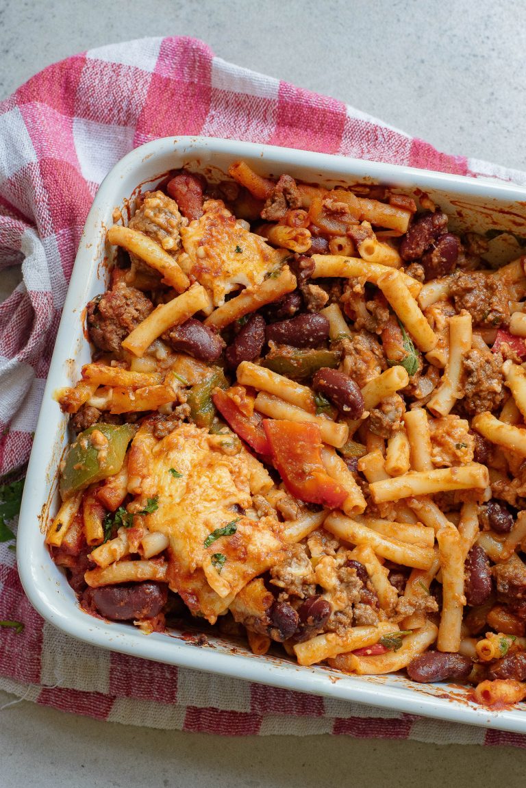 A casserole dish filled with pasta and beans.