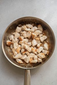 Fried chicken in a frying pan.