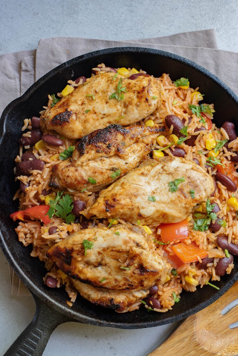 Chicken and rice in a skillet.