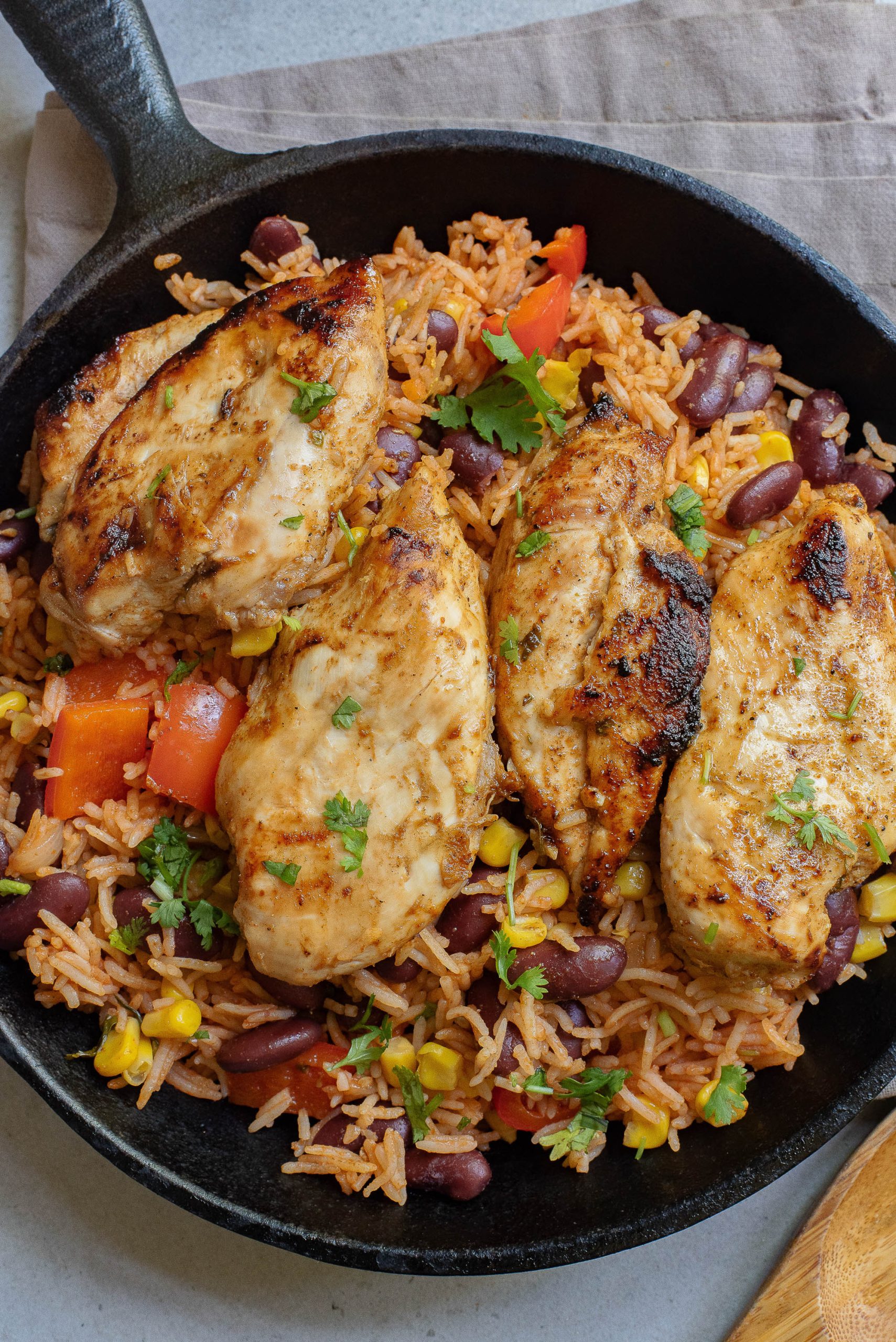 Chicken and rice in a skillet.